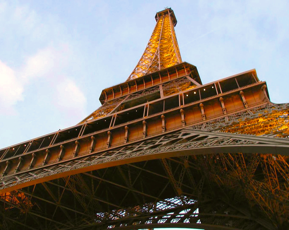 The Eiffel Tower rising majestically overhead, Paris